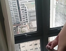 Asian Convulsive off in front of Majuscule Hotel window