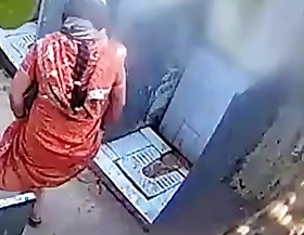 Desi bhabhi pissing encircling open toilet